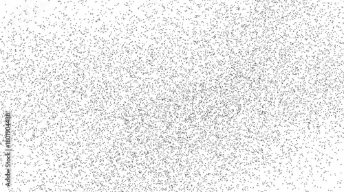 Dense scattering of small grey dots and squares on a white background creating a textured pattern abstract
