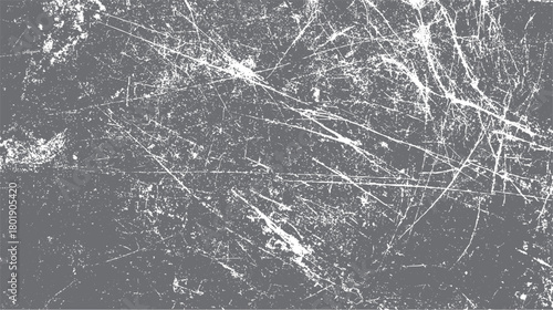 Distressed grey background with white scratches and speckles creating a grunge texture effect scratched
