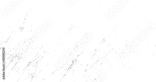 Scattered grey dust particles and streaks on a white background creating a textured grunge effect dirt