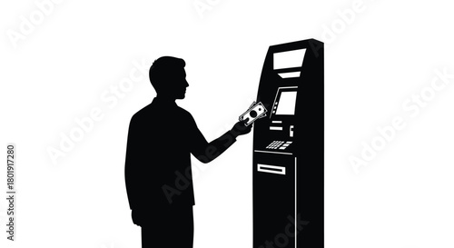 Silhouette of a person using a modern self service kiosk or atm machine for transactions