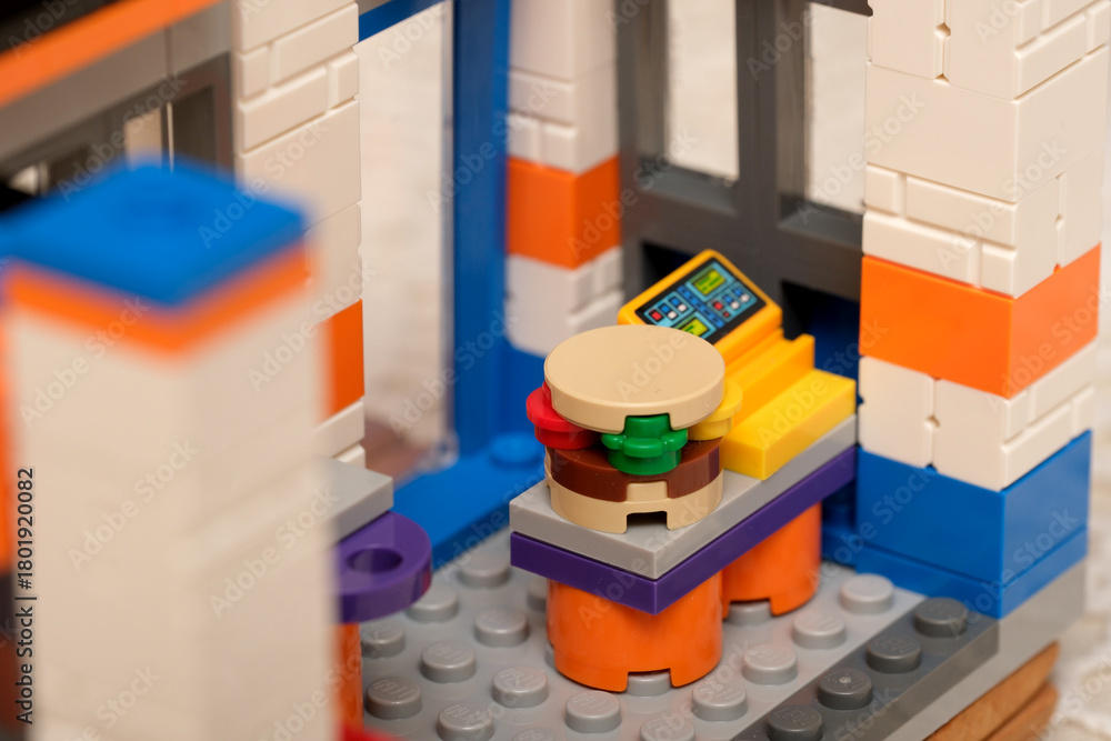 Naklejka premium Colorful toy kitchen scene with fun food items and accessories