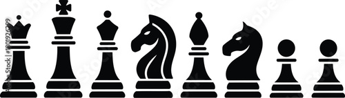 Collection of Black Chess Pieces in a Row
