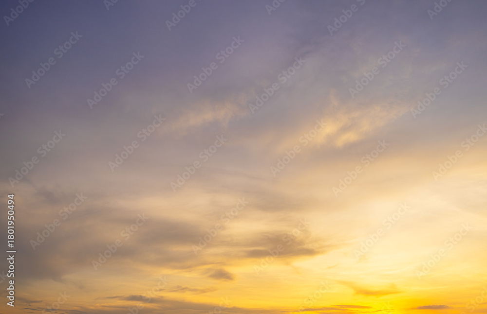 Fototapeta premium Clouds and orange sky backdrop,Sky,sunset, beautiful , luxury soft gradient orange gold clouds and sunlight on the blue sky perfect for the background, wilight summer,silhouette.