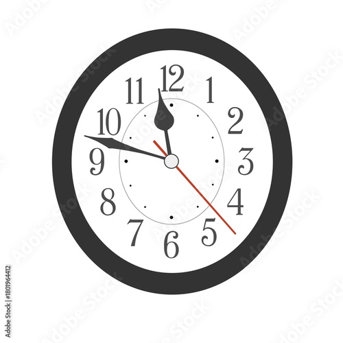 Elegant black oval wall clock placed on white