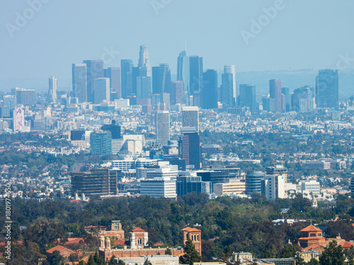 Hazy, wide panoramic view of the Los Angeles downtown skyline.