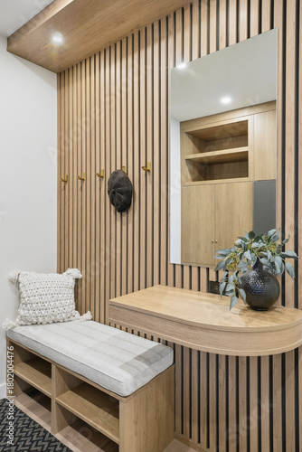 Wooden hallway with a bench and a mirror