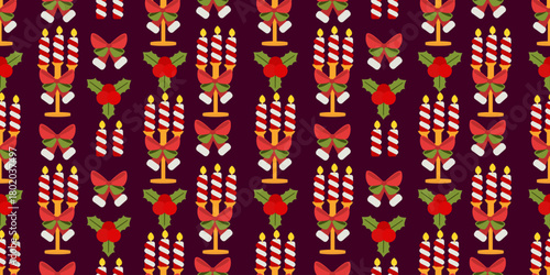 Seamless pattern showcasing striped lit candles in candle holder, holly leaves and red bow on dark background. Perfect for elegant Christmas wrapping paper, textiles and festive designs.