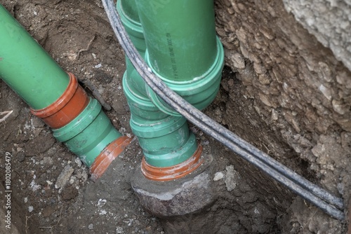 Wallpaper Mural Construction worker, newly laid green sewage pipes, Stuttgart, Baden-Württemberg Torontodigital.ca