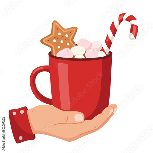 Hot chocolate with marshmallows and gingerbread cookie in red mug for festive winter occasions 