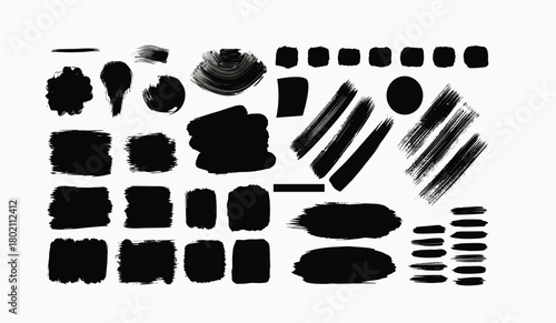 Collection of black ink brush strokes and paint splatters on a white background