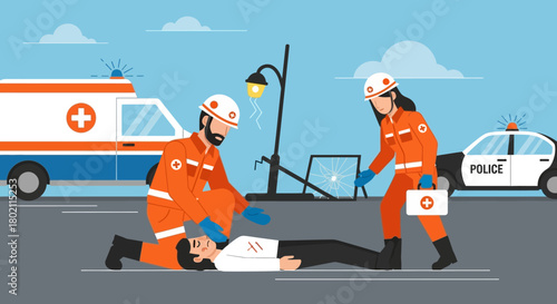 Emergency responders providing first aid to an injured person on the street, with an ambulance and police car in the