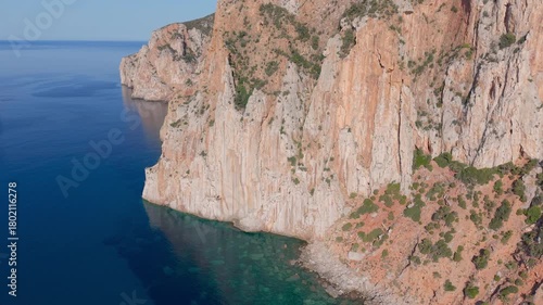  castle nestled on vertical cliffs above serene mediterranean coves near italy. Porto Flavia