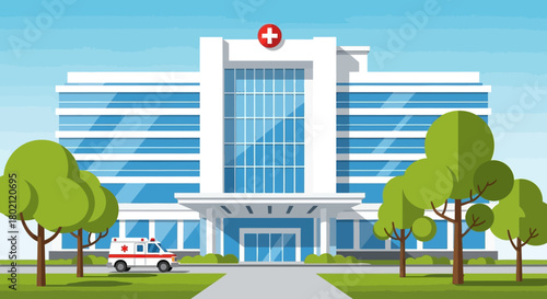 Modern hospital building with red cross symbol on top, featuring large glass windows and an ambulance parked outside