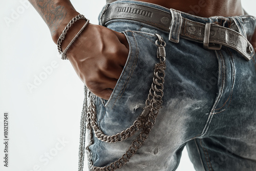 Man wearing stylish jeans with hand in pocket close-up fashion portrait