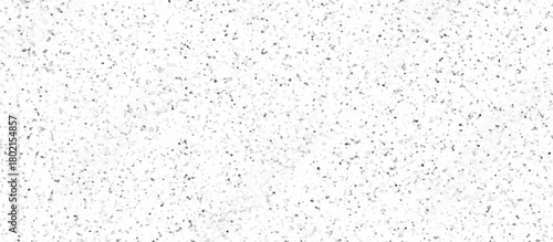 White terrazzo background with scattered gray and black dots. Rock spatter stone marble backdrop. Wall texture with noise overlay pattern. Vintage quartz terrazzo flooring.	