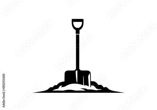 Shovel resting in pile of dirt in black silhouette style  