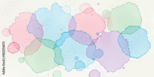 Abstract watercolor splashes in pastel colors creating a soft and dreamy background.