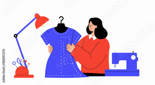 Woman fashion designer meticulously working on a blue dress pattern with essential sewing tools like a machine, lamp, and pincushion.