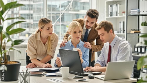 Wallpaper Mural Group of young professionals working together in a modern office environment. Team brainstorming around laptops, discussing ideas, and planning project strategies, supporting teamwork and productivity Torontodigital.ca