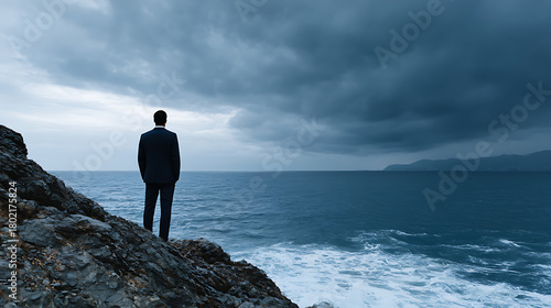 Fototapeta Naklejka Na Ścianę i Meble -  Emotional Portrait Of Businessman Facing Dark Turbulent Sea Under Angry Sky, High Contrast