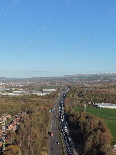 Aerial view of busy traffic on a motorway in greater Manchester  with lane closures. Bury Manchester England. 