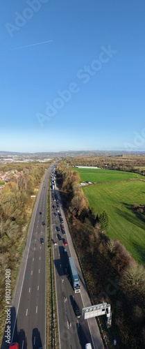 Aerial view of busy traffic on a motorway in greater Manchester  with lane closures. Bury Manchester England. 