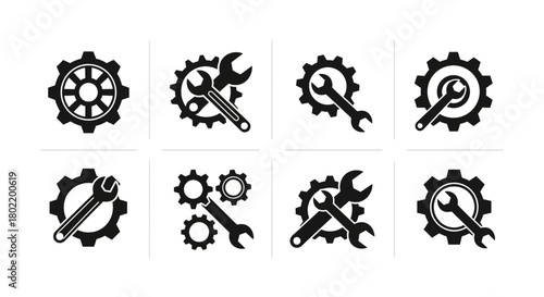 Set of black gear and wrench icons for industrial and repair themes