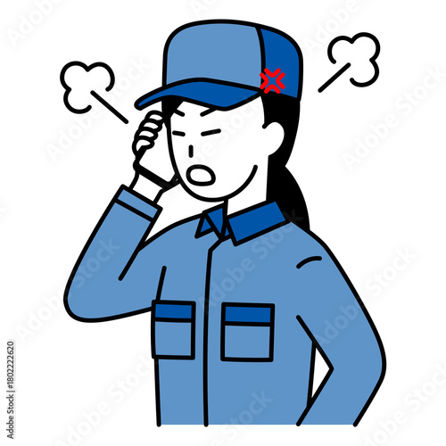 スマートフォンでの通話で怒るつなぎ作業服の女性