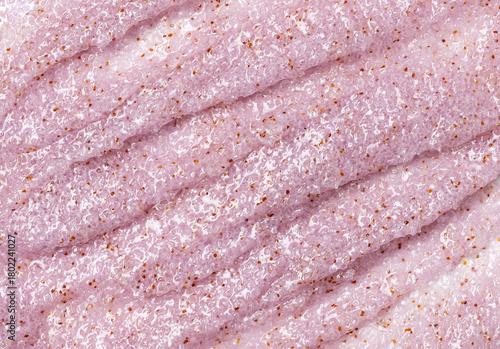 Sugar or salt body scrub texture. purple  scrub - skin care product with berry extract as cosmetic background with copy space. Macro photo