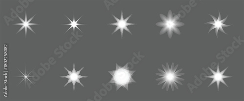 Ten white starbursts on grey background sparkle glitter 1