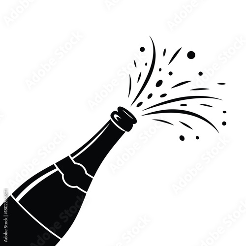 Champagne bottle popping with celebratory spray of liquid