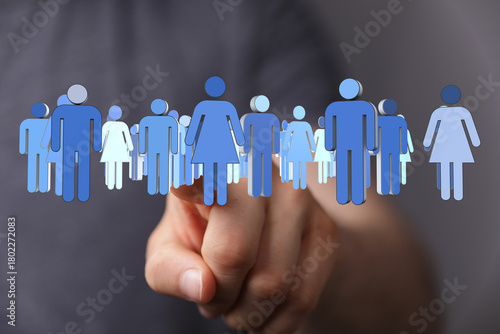 Hand pointing at a group of...