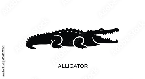 A simple black silhouette of an alligator resting on a white background