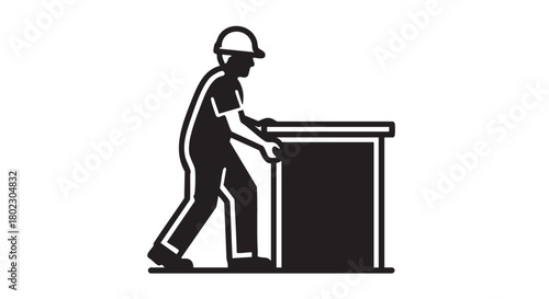 Determined worker moving a substantial heavy object, symbolizing the physical demands of manual labor, industrial efficiency, and the careful execution of handling tasks