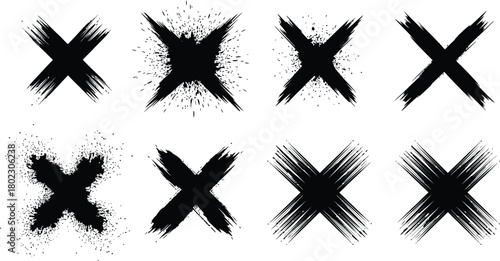 Collection of eight grunge hand drawn black x marks with splatter and brush stroke textures
