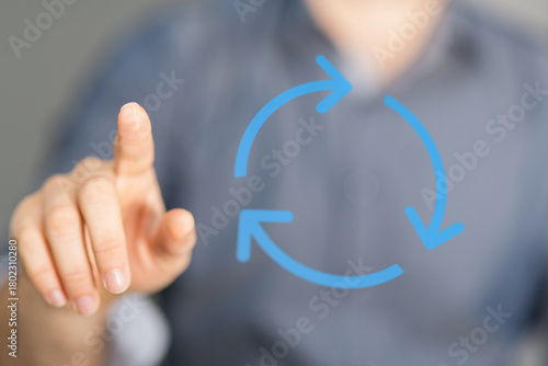 Hand pointing towards blue ...