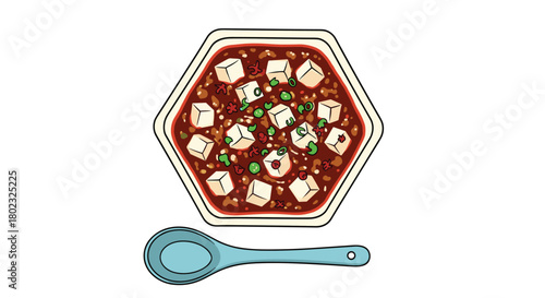 A vibrant overhead view of mapo tofu in a hexagonal bowl with a blue spoon, showcasing the spicy Sichuan dish's rich red sauce and cubed tofu.