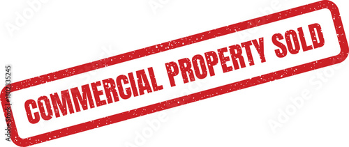 A vibrant red rectangular rubber stamp displays the words Commercial Property Sold on a bright white background