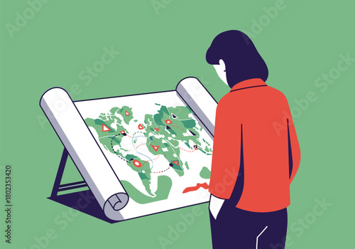 Woman analyzing world map on easel for geographic research and planning