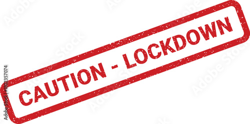 Distressed red rubber stamp displays a Caution Lockdown message on a clean white surface