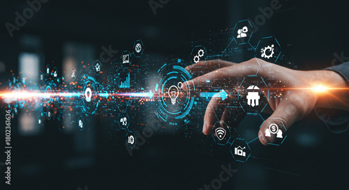 Futuristic hand interacting with glowing digital interface displaying business growth icons and innovation symbols, signifying digital transformation and data analysis.