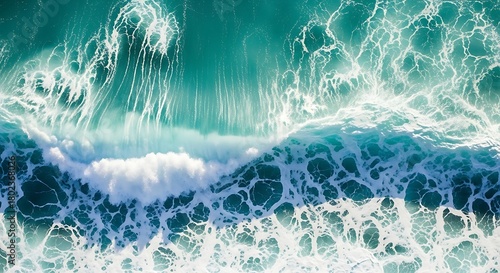 Fototapeta Naklejka Na Ścianę i Meble -  Vibrant turquoise ocean waves crashing creating foamy patterns