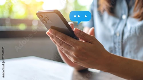 Woman texting on smartphone with bubble.