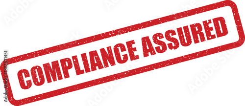 This image displays a distressed red rubber stamp bearing the important phrase Compliance Assured on a clean white background