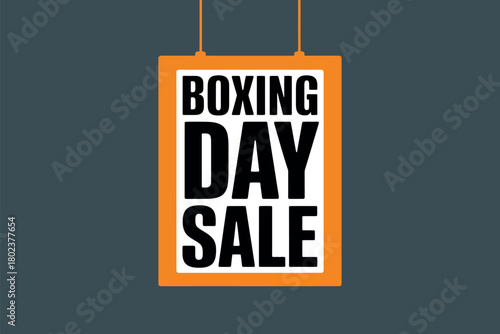 A bold orange and white sign announces a Boxing Day sale against a dark grey background.