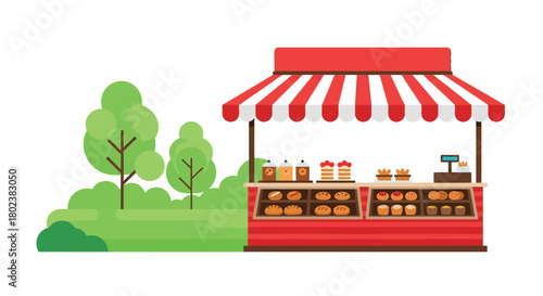 A colorful outdoor market stall selling baked goods and sweet treats
