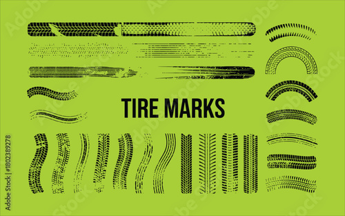 Black tire tracks and tread patterns on a green background