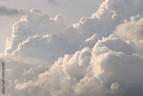 A beautiful fluffy clouds on sunny day with dramatic golden hour sky background.