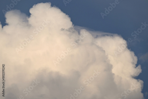 A beautiful fluffy clouds on sunny day with dramatic golden hour sky background.