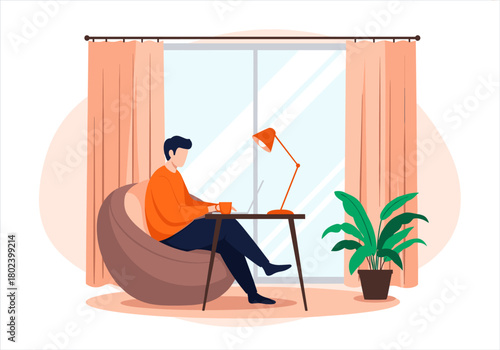 Man working on a laptop while sitting in a comfortable bean bag chair at home.